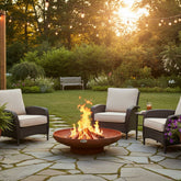 corten steel fire bowl on a patio surrounded by chairs