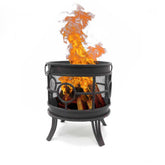 Black metal fire pit with flames on a white background