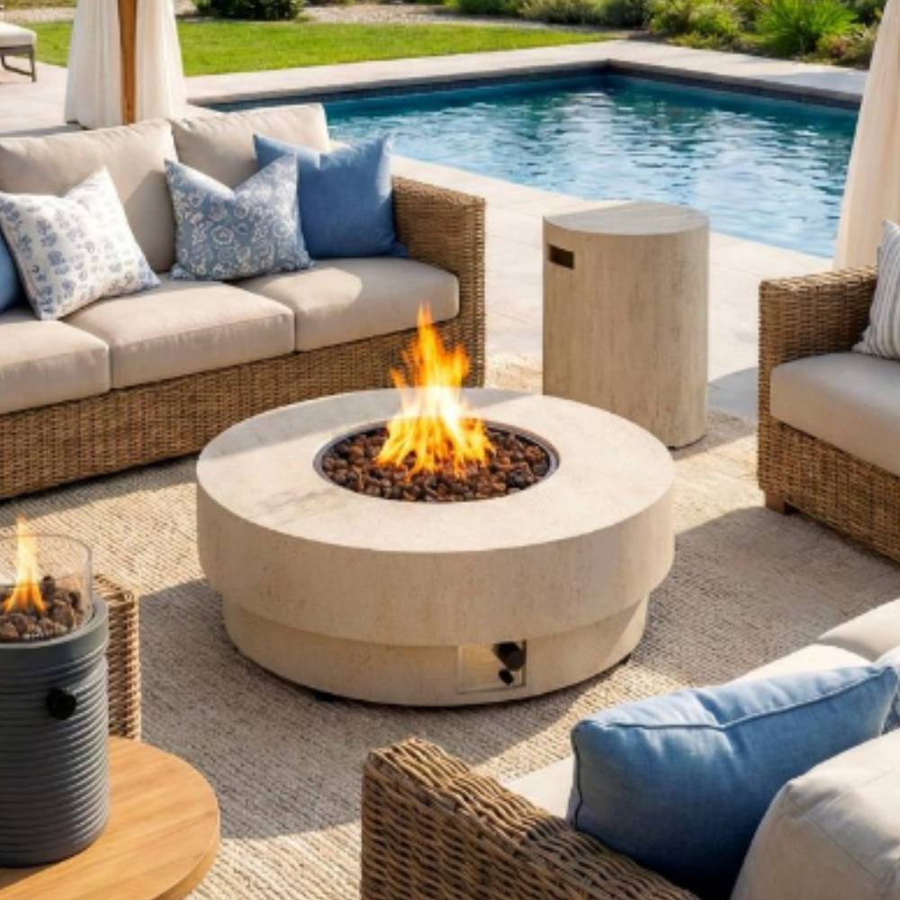 Outdoor patio with fire pit table, wicker chairs, and cushions by a pool.
