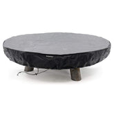 Round fire pit with a black cover on a white background