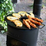 Outdoor cooking setup with a portable stove and grill, featuring skewered food.