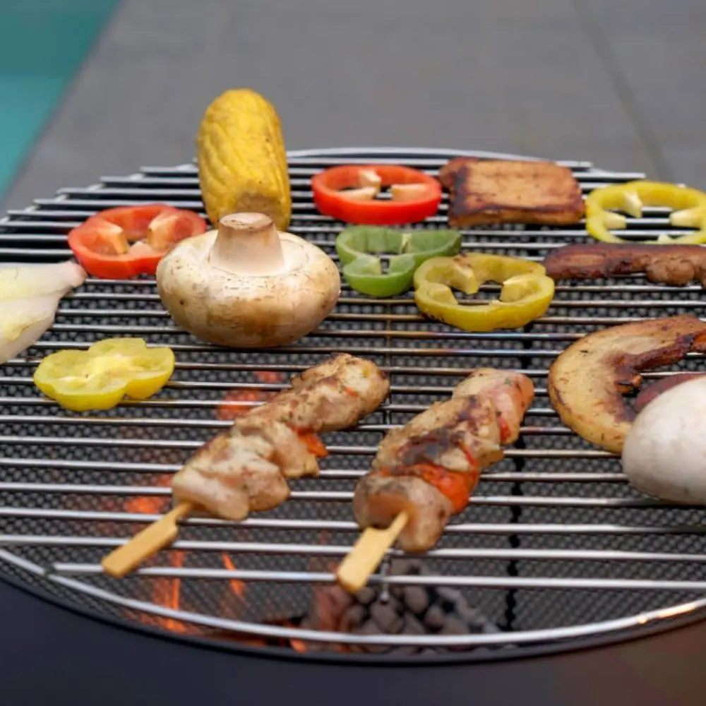 Grilled vegetables and skewers on a barbecue grill