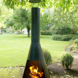 Outdoor chiminea with flames burning in a garden setting