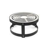 Round metal fire pit grill with concentric circular design on a white background