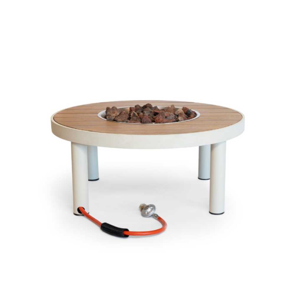 Round fire pit table with wooden top and white legs on a white background
