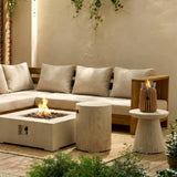Outdoor seating area with a fire pit table, Table Top Burner and decorative candles.