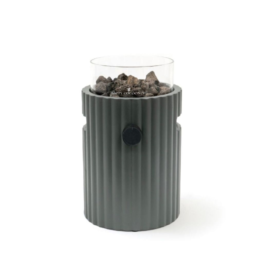 Gray table top burner with glass top holding rocks on a white background