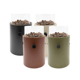 Set of four table top burners in different colors with pet food inside on a white background.
