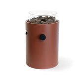 Cylindrical table top burner glass top and brown body on a white background
