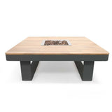 Square fire pit table with wooden top and metal base on a white background