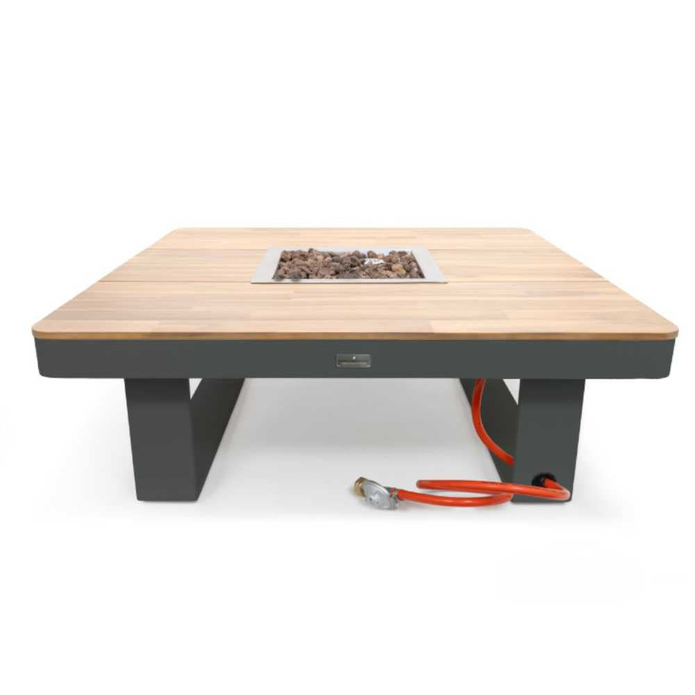 Wooden fire pit table with black base and red hose on a white background
