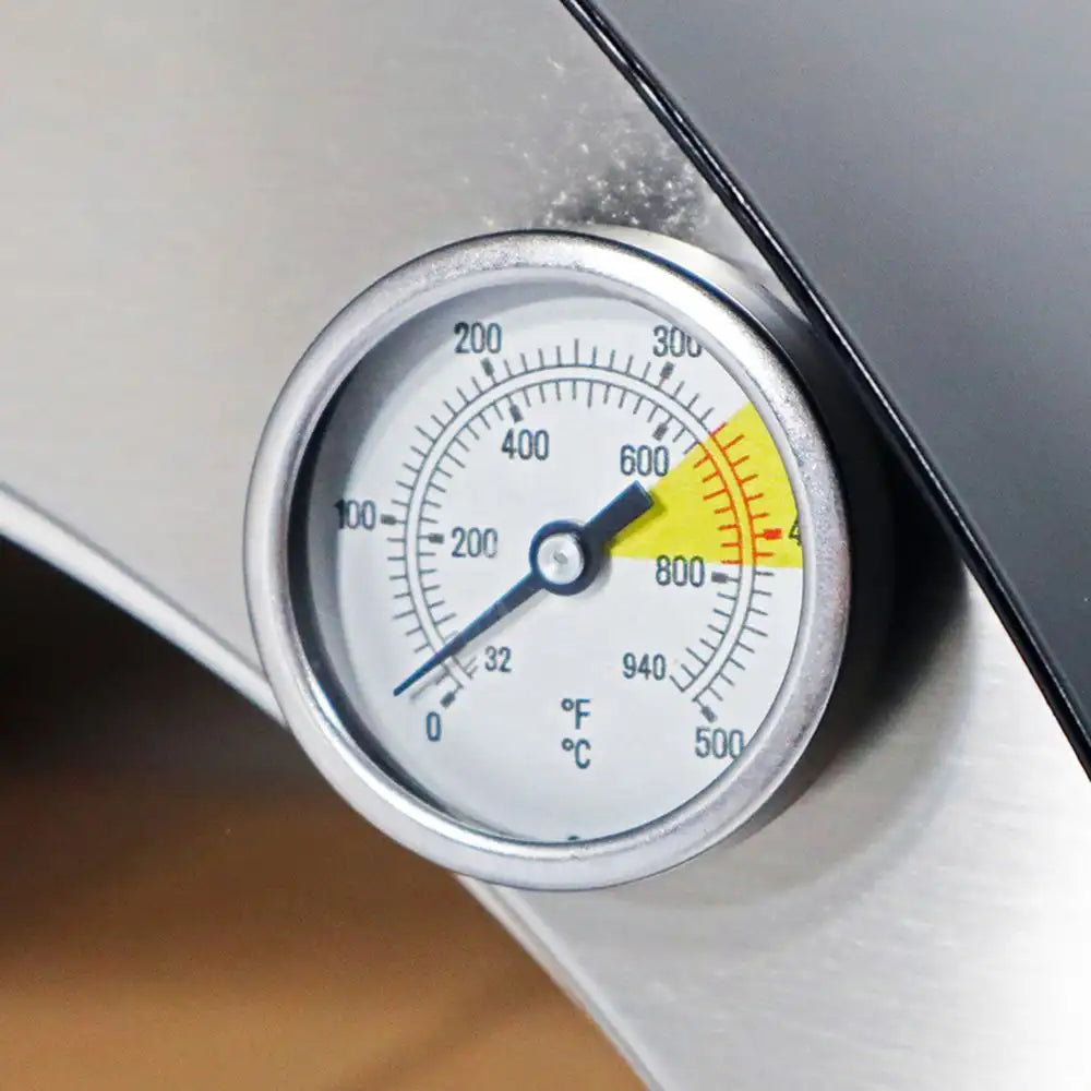 Thermometer gauge on a metallic surface with temperature markings